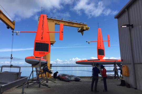 Technicians prepare the first two Saildrones for launch from Neah Bay, Washington. Credit: NOAA Fisheries